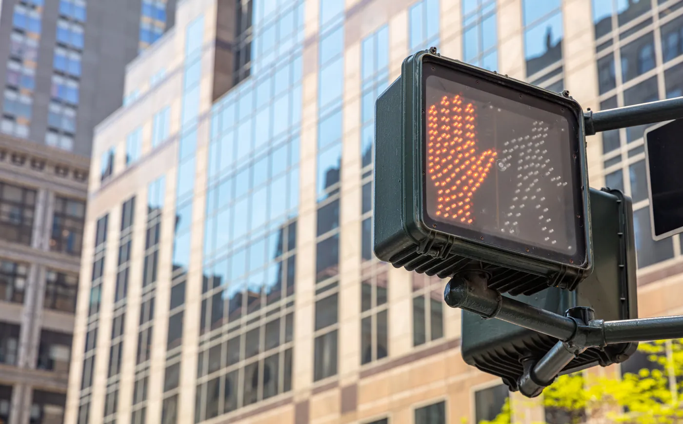 Red hand pedestrian signal at a New York City crosswalk